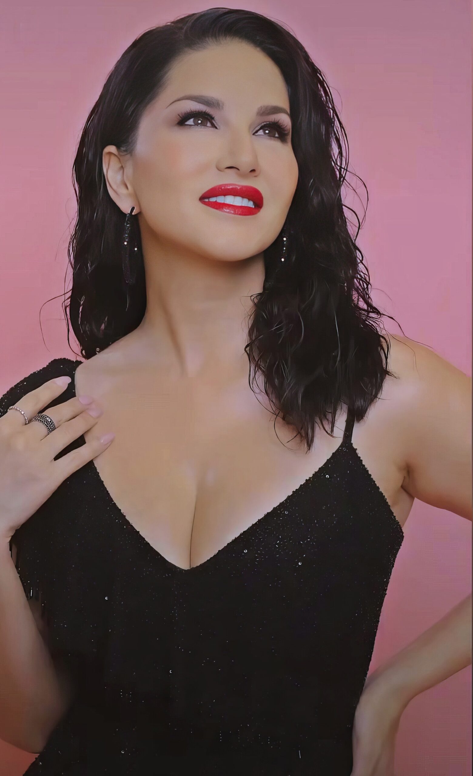 Sunny Leone at 43 Years Old as Erotic Centerfold Model and Bollywood India Star (2024) Red Lips Wet Hair Brunette Black Bright Dress