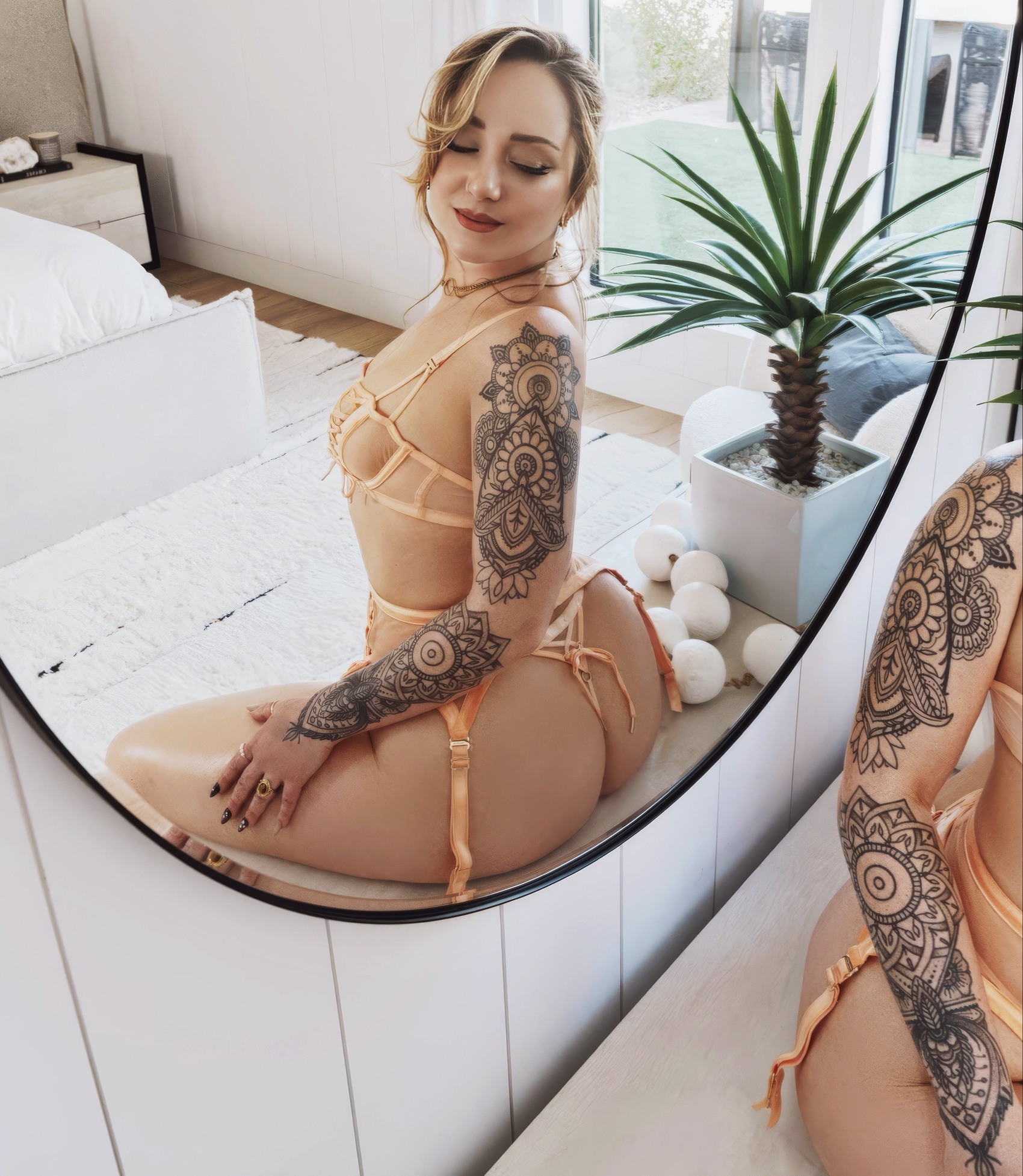Remy LaCroix at 37 Years Old as Erotic Centerfold Model (2026) Orange Lacy Lingerie MILF Blonde Hair on Bed Glamour All Natural