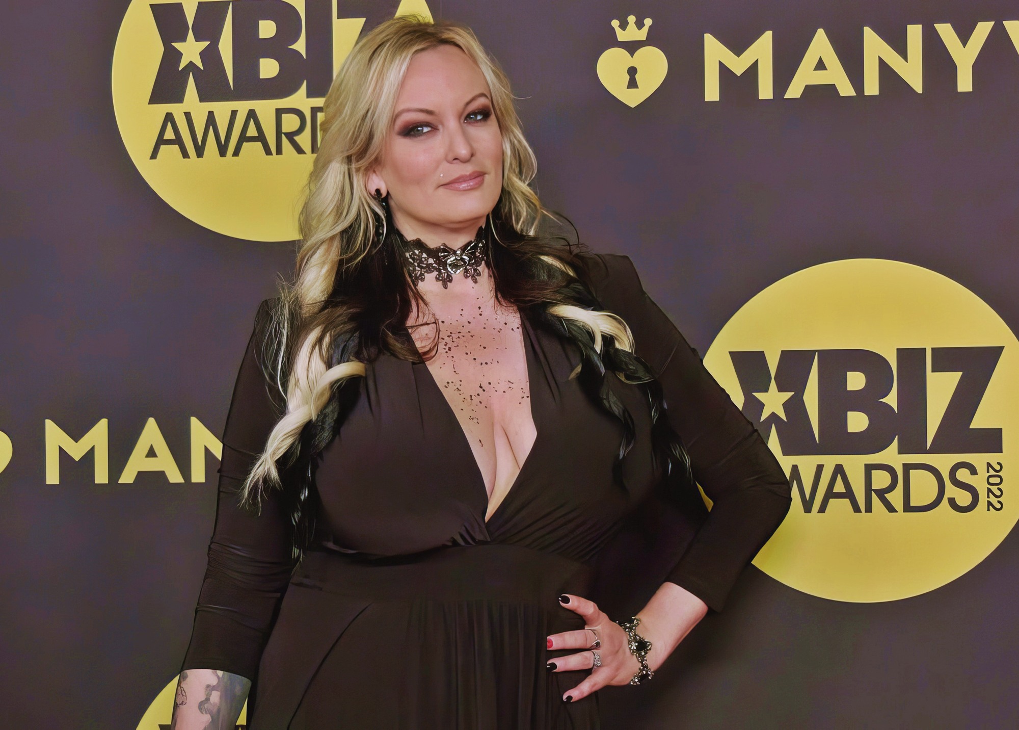 Stormy Daniels at 42 Years Old at Red Carpet XBIZ Awards 2022 Red Dress Night Big Busty MILF Blonde