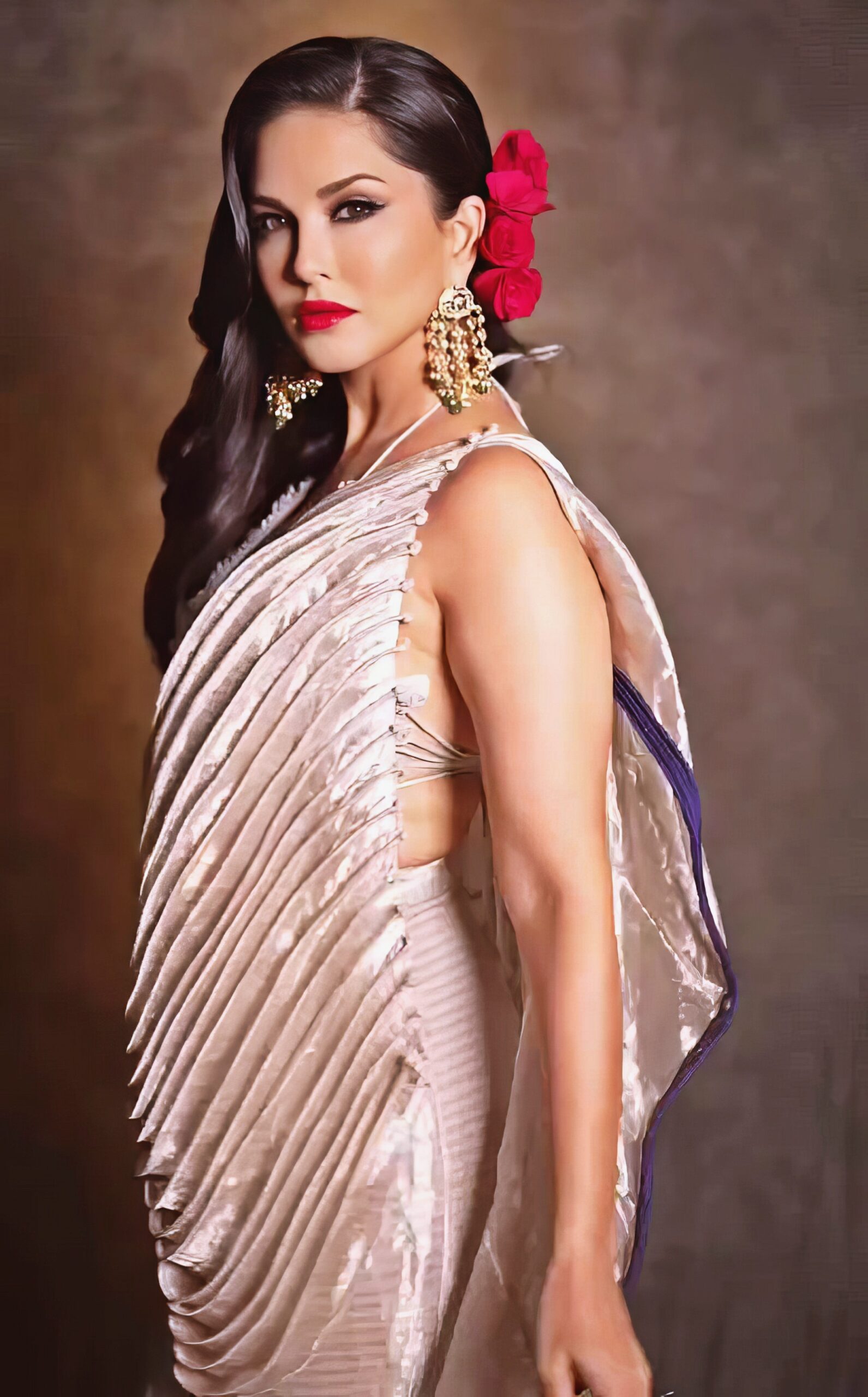 Sunny Leone at 43 Years Old as Erotic Centerfold Model and Bollywood India Star (2024) Luxure Bright Beige Dress Red Lips