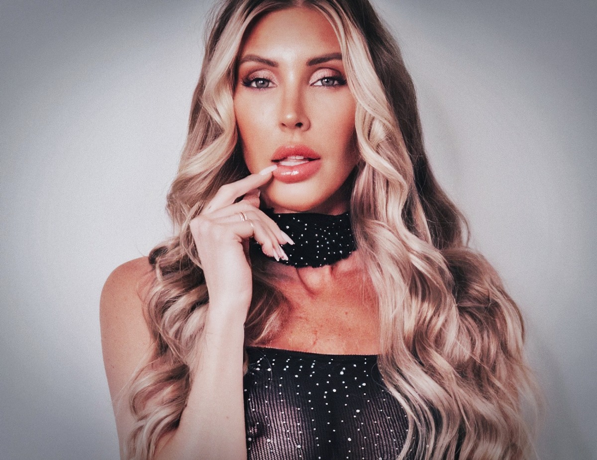 Samantha Saint at 38 Years Old as Tallest Blonde Busty Bombshell MILF as Erotic Centerfold (2026) Black Bright Whore Dress